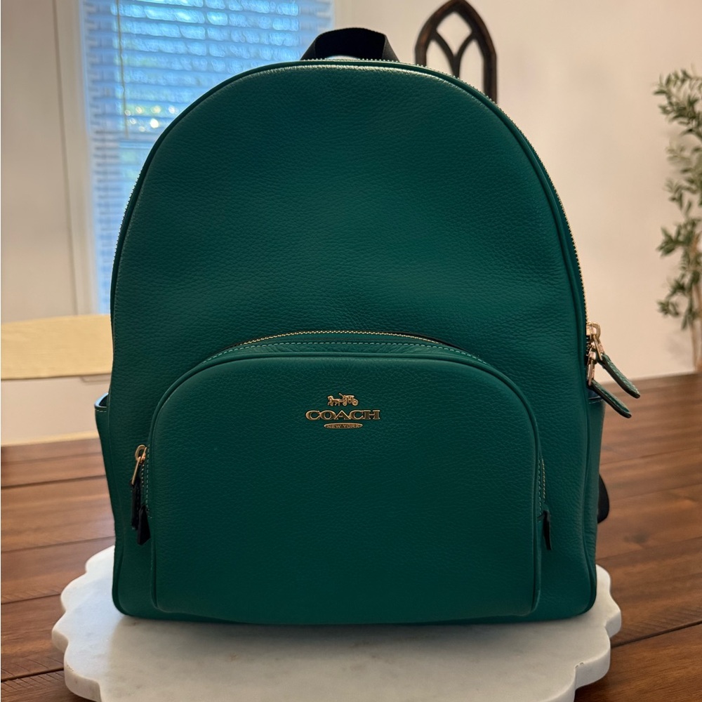 Coach Green Backpack with Gold-Tone Hardware and Structured Design
